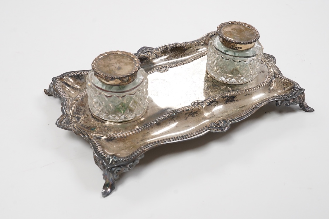 An Edwardian silver rectangular inkstand with two mounted glass wells, by Charles Stuart Harris, London, 1903, length 24.9cm, 12.2oz.